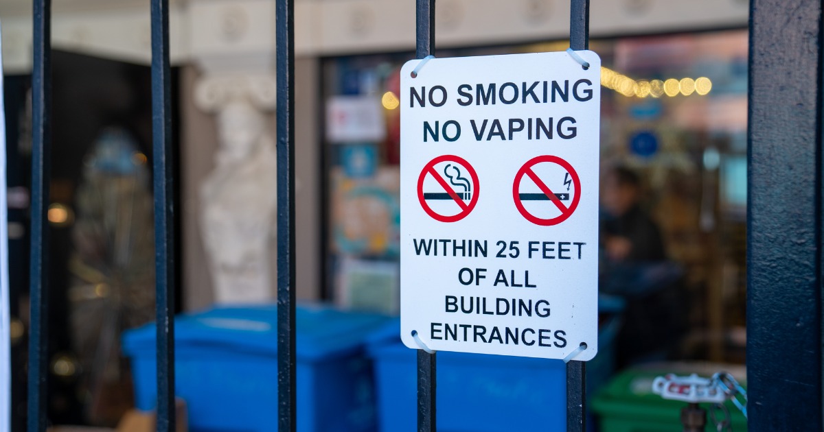 Sign that says "No smoking, no vaping within 25 feet of all building entrances"