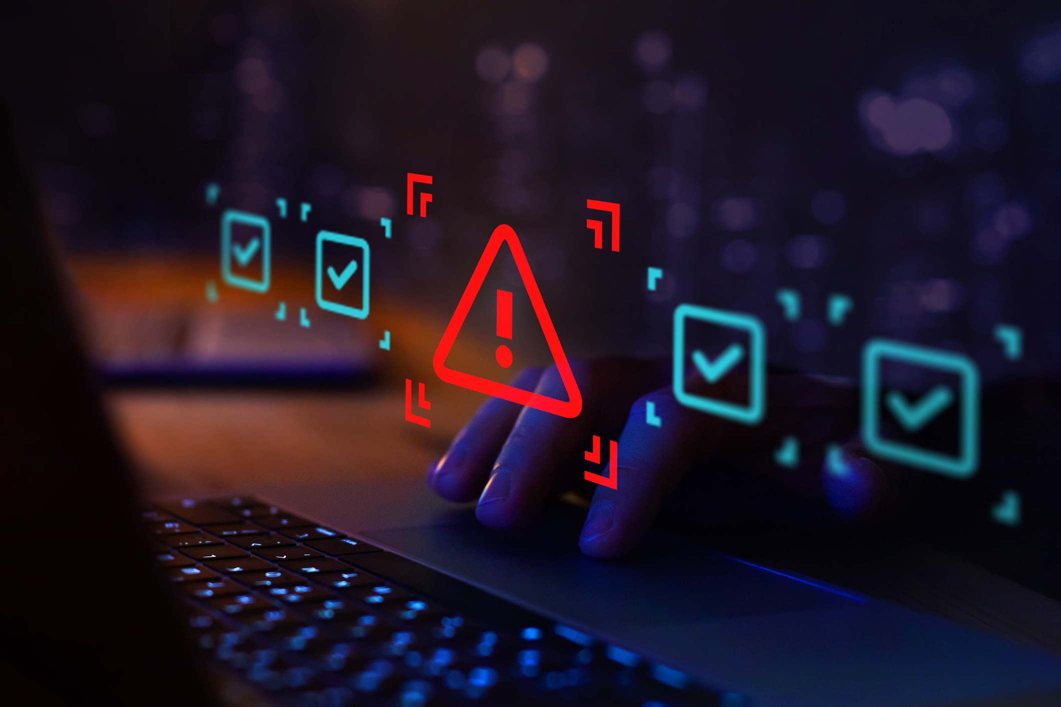 Laptop keyboard closeup with lit-up warning signs. Don't blow up Chromebooks at home