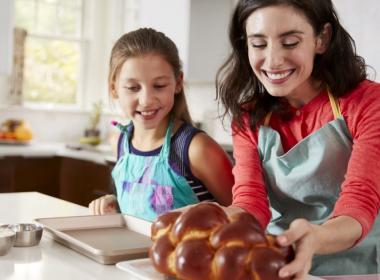 A mother and daughter bake Challah