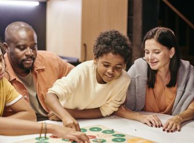 A family plays a board game