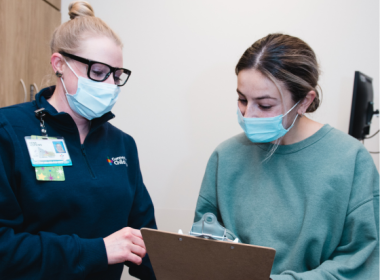 clinician reviewing forms with patient