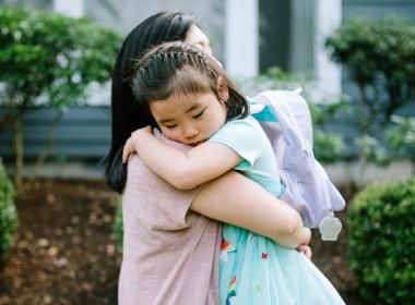 Mom hugging her daughter