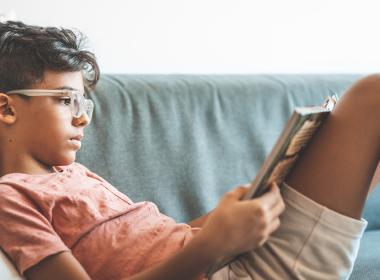 A young boy reading a book