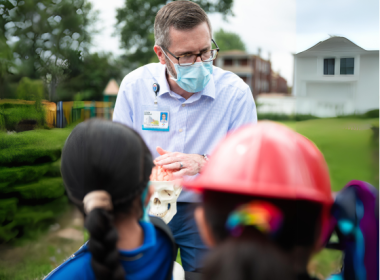 doctor giving talk at school